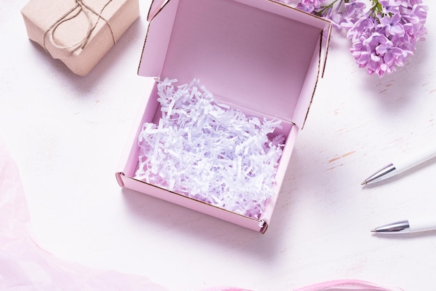 Brown cardboard box decorated with lilac branch