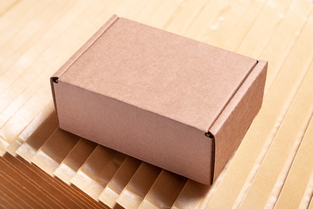 Brown cardboard box on lot of bubble envelopes