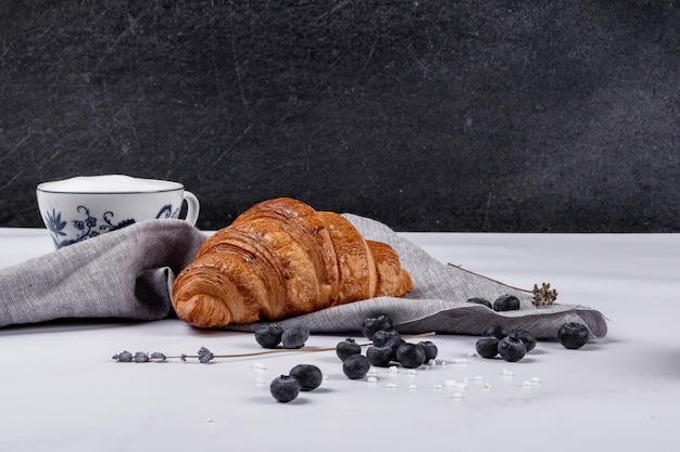 brown chocolatine croissant blueberries breakfast food