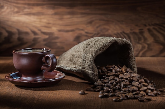 Brown coffee cup and sack with beans