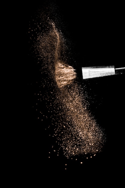 Brown color , powder splash and brush for makeup artist