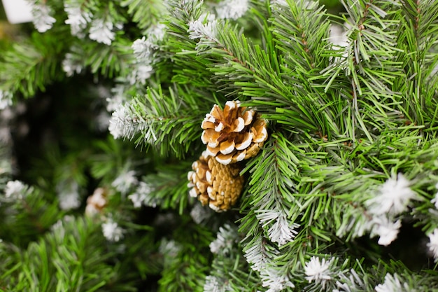 Brown cone on artificial Christmas tree