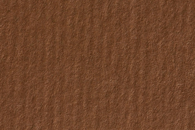 Brown craft paper texture with horizontal stripes for background. High resolution photo.