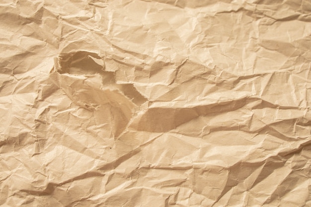 Brown crumpled paper close up texture background