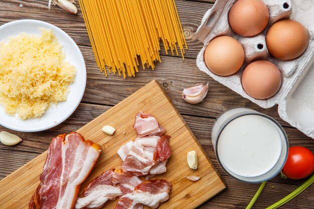 Brown desk with bacon, pasta