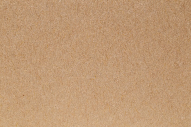 Brown eco recycled kraft paper sheet texture cardboard background.