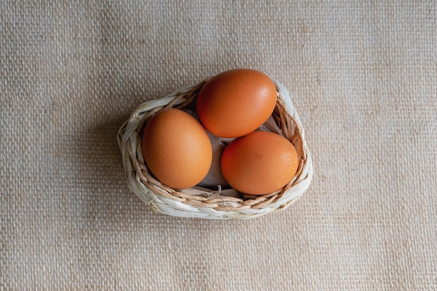 Brown eggs on a background of burlap