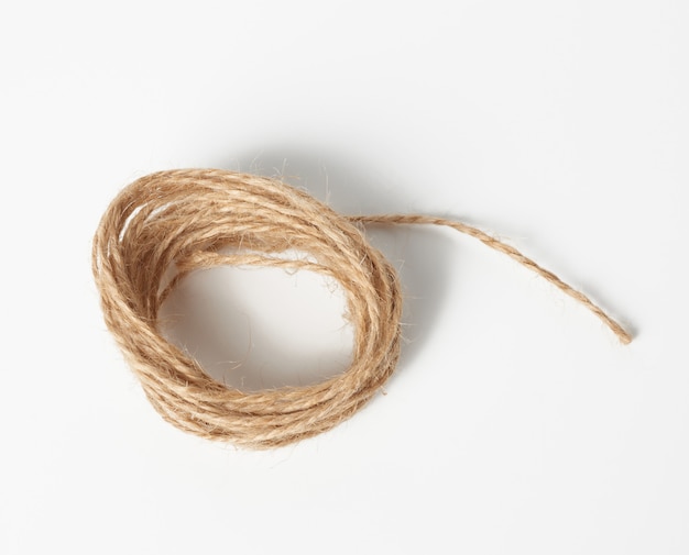 Brown folded twine on a white space