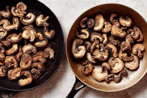 Brown fried mushrooms in frying pan with spices