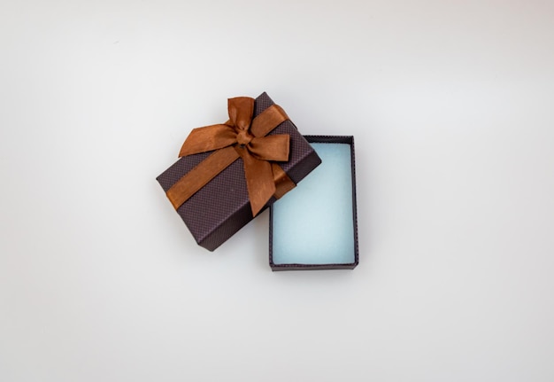 Brown gift box on isolated background open jewelry box jewelry mockup concept of shopping holiday gi