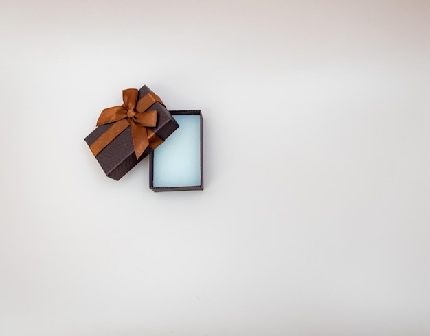 Brown gift box on isolated background open jewelry box jewelry mockup concept of shopping holiday gi