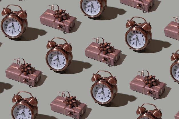 Brown gift box template with bow and alarm clock on gray background Festive minimalistic concept