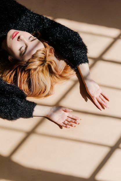 Brown hair woman in a black fluffy sweater