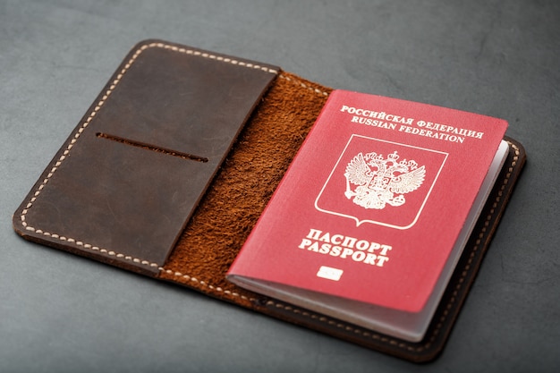 Brown leather cover with a red passport