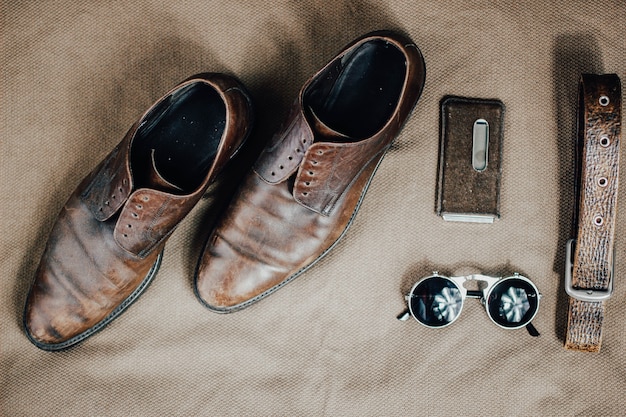 Brown leather retro shoes belt steampunk sunglasses and a pocket watch Vintage style