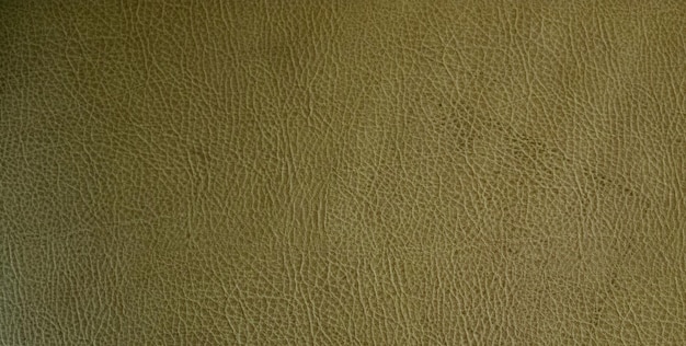 Photo a brown leather texture with a black spot on the top.