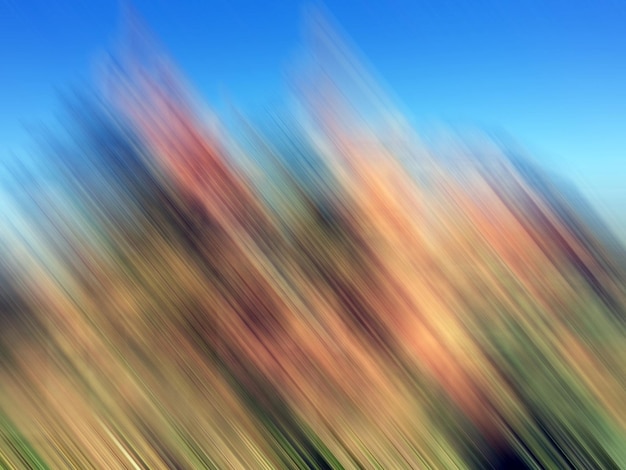 Photo brown mountains against a blue sky in a blur of motion