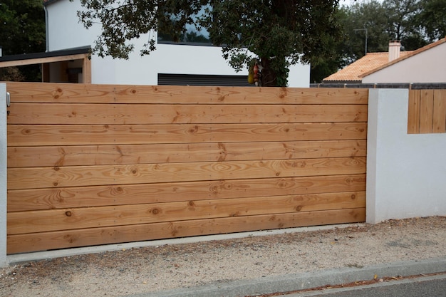 Brown natural wooden portal in wood of house gate garden access door