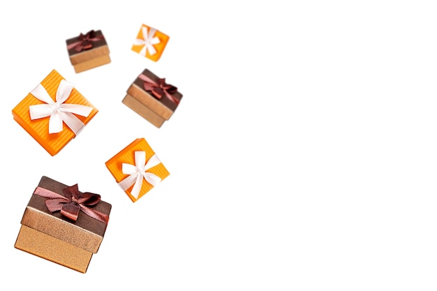 brown and orange boxes flying on a white background