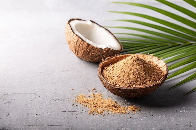 Brown palm or coconut sugar on grey