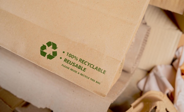 Brown paper bag that is 100 recyclable and reusable with green recycling symbol ecofriendly and save the world concept