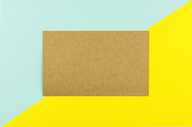 Photo brown paper on blue and yellow paper background.