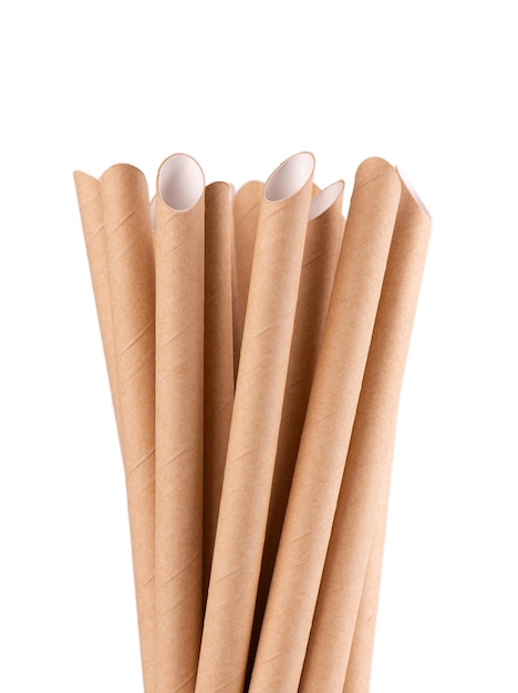 Brown paper drinking straws isolated on white background Ecofriendly paper straw environmental consciousness concept