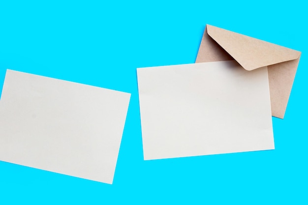 Brown paper and envelopes on blue background