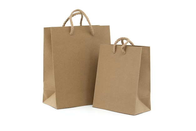 Brown paper shopping bags with handles on a white background