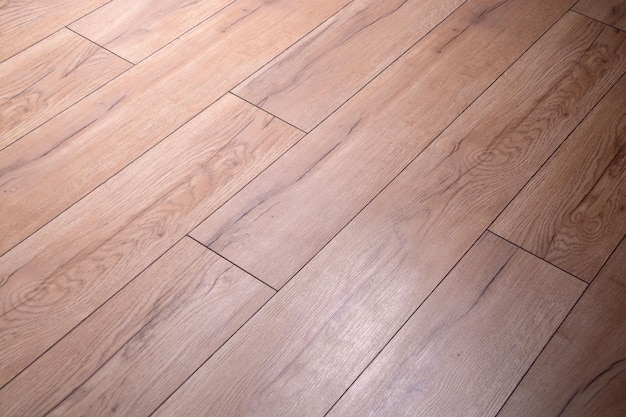 Brown parquet board with rough texture and illumination.