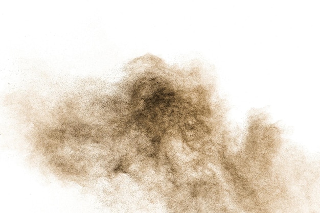 Brown particles splash on white background Brown dust splatter