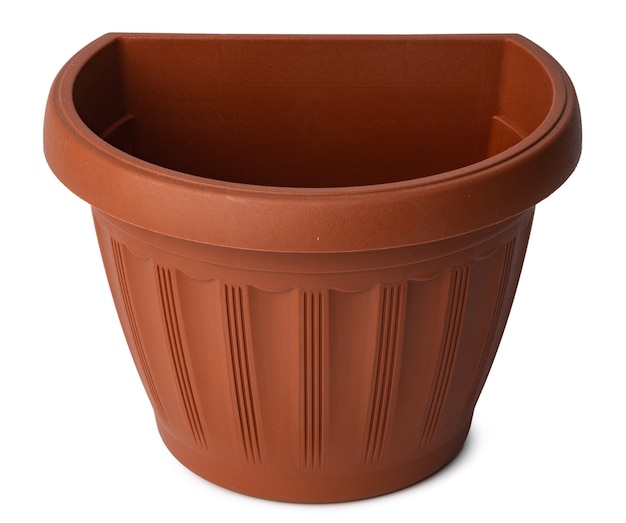 Brown plastic flower pot isolated on white