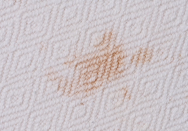 Brown stain on white fabric