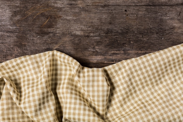 brown table cloth on wooden table background