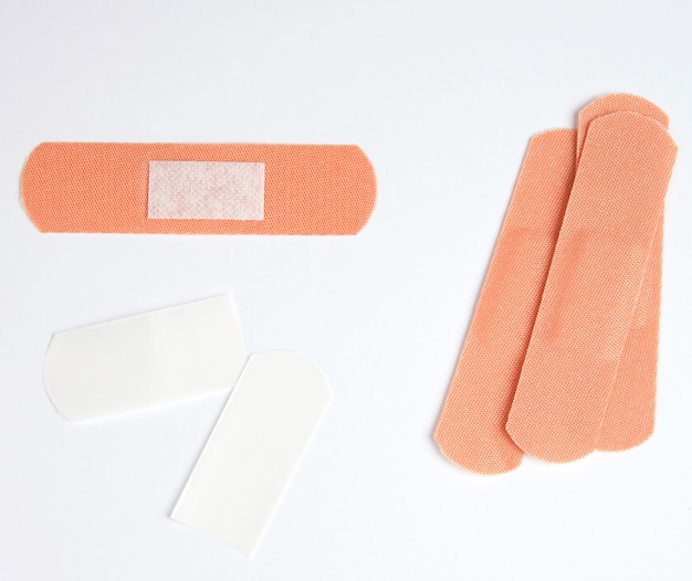 Brown textile sticky patch for wounds on the skin of the body