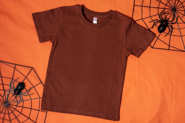 Brown tshirt mockup on orange halloween background