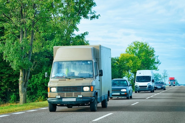 Brown Van at the asphalt road in Slovenia.