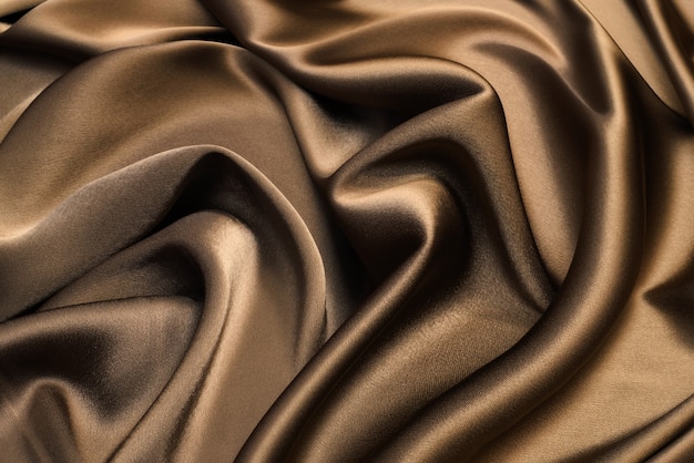 Brown viscose fabric texture. Background, pattern.