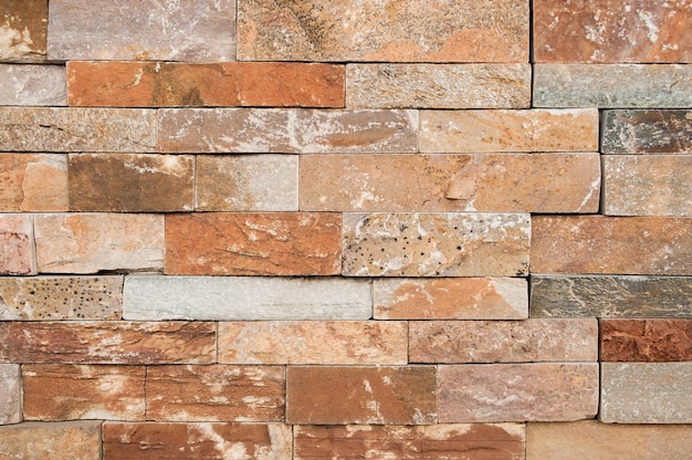 Brown with orange stone wall tiles texture natural brown stone dirty dust with pattern design