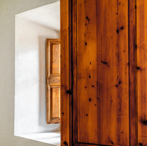 Brown wooden shutter of a window in a rustic house of Majorca