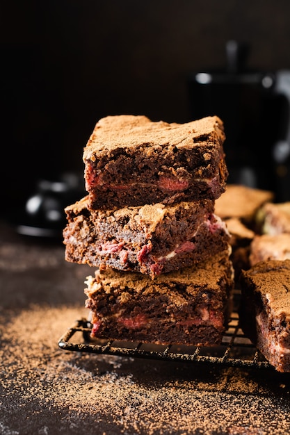 Brownie cheesecake cake with cherry and chocolate