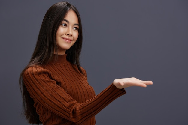 Brunette brown sweater glamor posing smile fashion isolated background