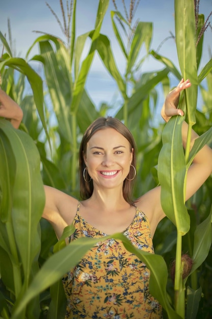 Brunette girl in a field of corn