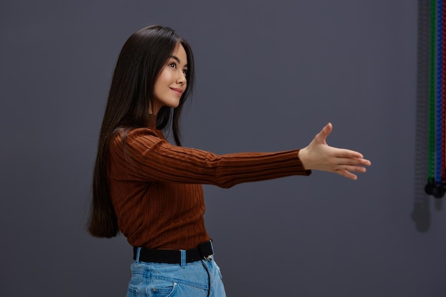 Brunette hand gestures brown sweater fashion isolated background