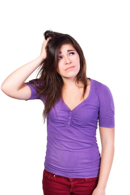 Brunette woman looking up scratching her head dumbfounded isolated on white