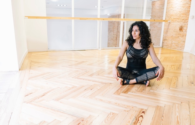 Brunette woman practicing yoga