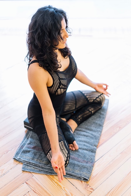 Brunette woman practicing yoga