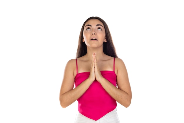 Brunette woman standing with praying hands