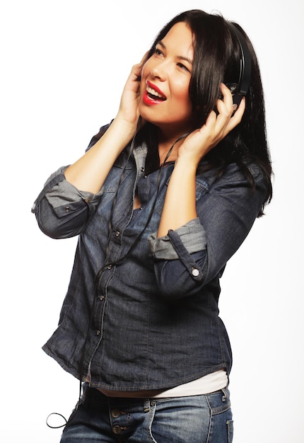 Brunette woman with headphones listening music