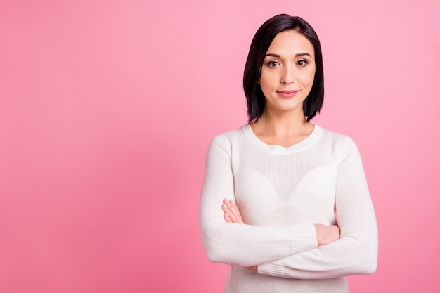 brunette woman with white pullover isolated on pink